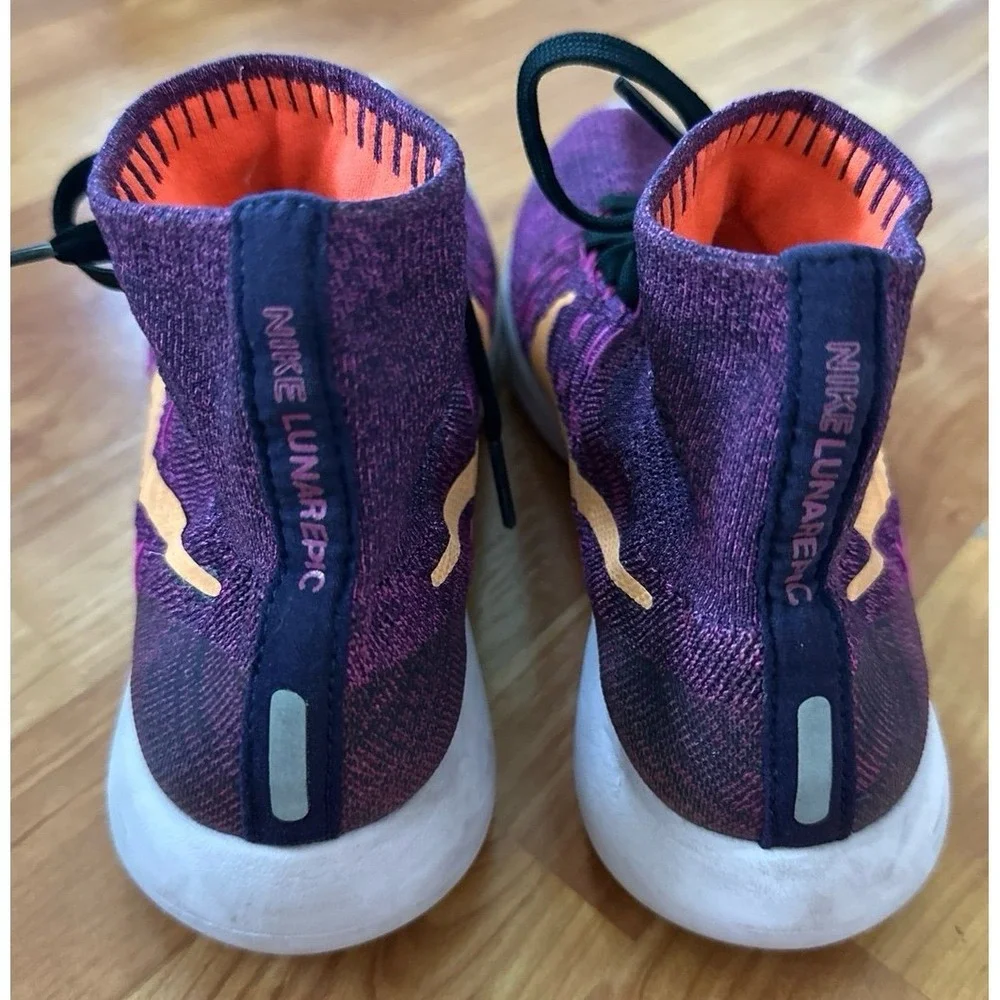 Nike LunarEpic Flyknit running shoes in a purple colorway with an orange swoosh.